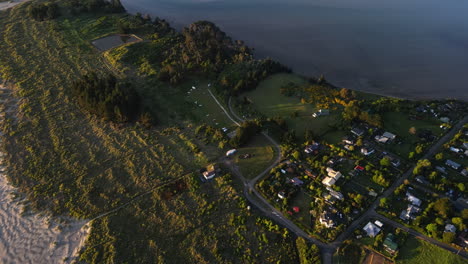 Warrington-domain,-small-village-on-peninsula-in-New-Zealand,-aerial-downwards-view