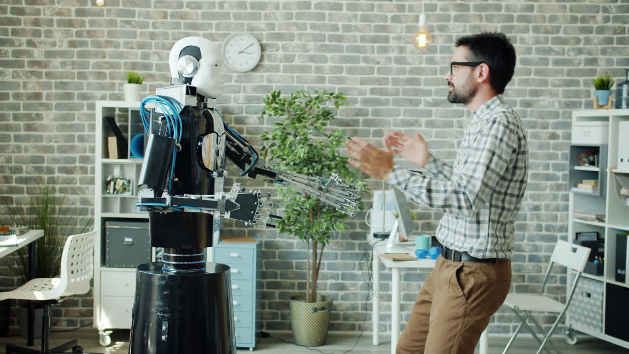 Robot and Man Dancing in Office