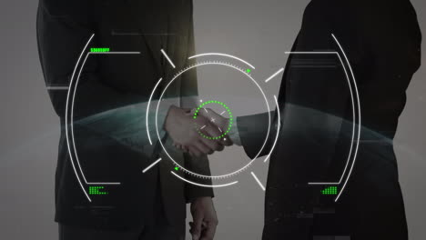 scope scanning over mid section of businessman and businesswoman shaking hands against globe