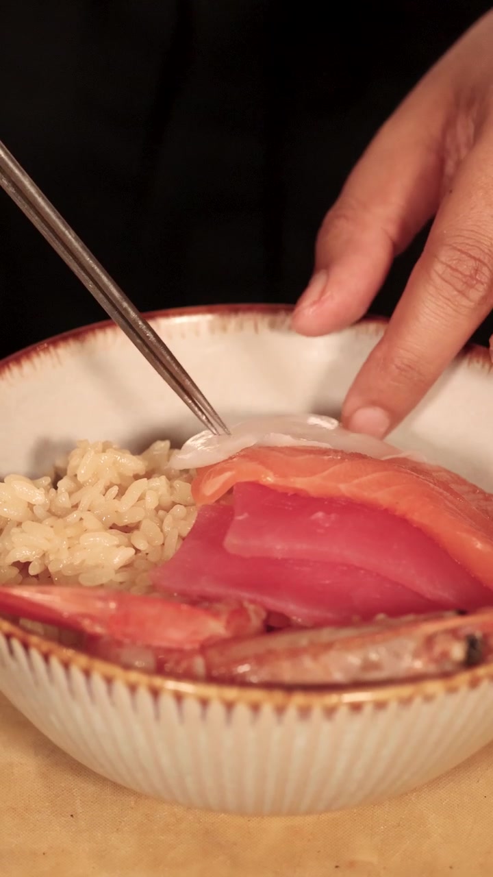Chef Assembling a Fresh Seafood Chirashi Rice Bowl