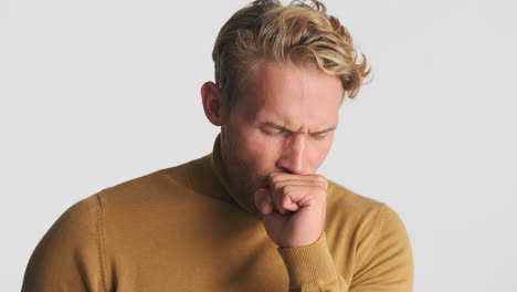 man feeling ill and coughing