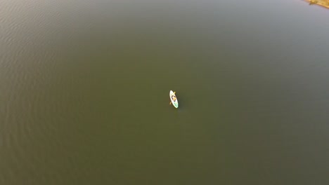 looking directly down at a canoe on a lake