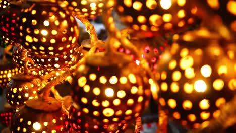 uniquely made lights in a coconut shell being sold in a street  market for decoration.