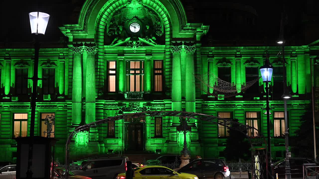 Bucharest, Romania - January 10, 2021: Street view of the illuminated Palace of the Deposits and Consignments in the evening