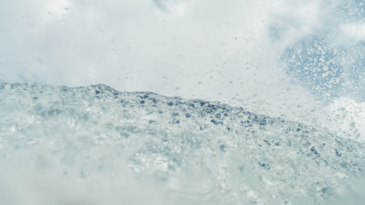 Flat ocean surface under bright daylight with distant horizon and minimal waves