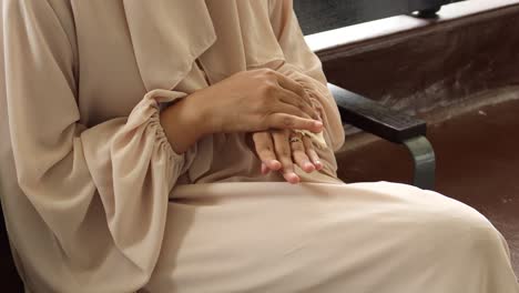 women disinfecting his hands with a wet wipe