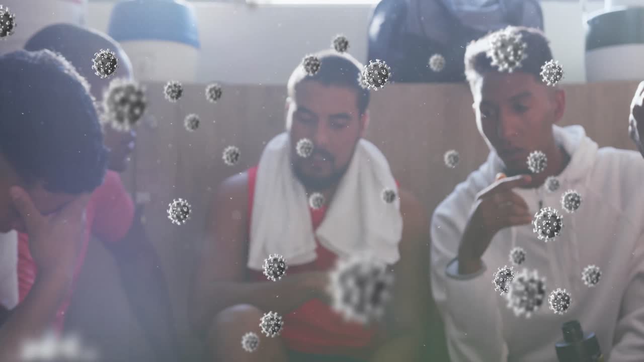 변기실에서 남성 축구 선수들의 다양한 그룹 위에 떠다니는 바이러스 세포의 애니메이션