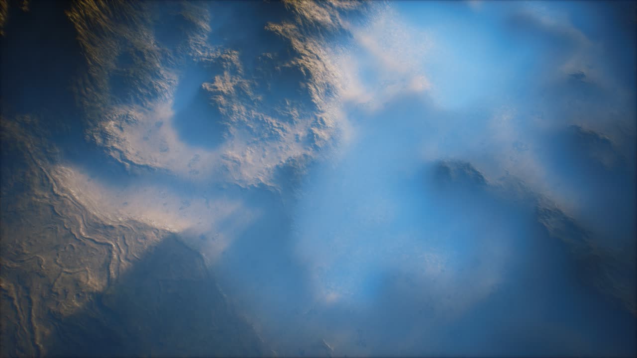 Distant mountain range and thin layer of fog on the valleys