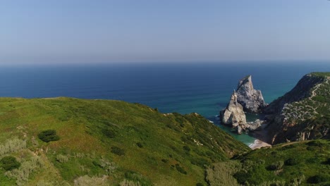 Aerial-View-of-Praia-da-Ursa-is-a-deserted-beach-located-in-Sintra,-Portugal