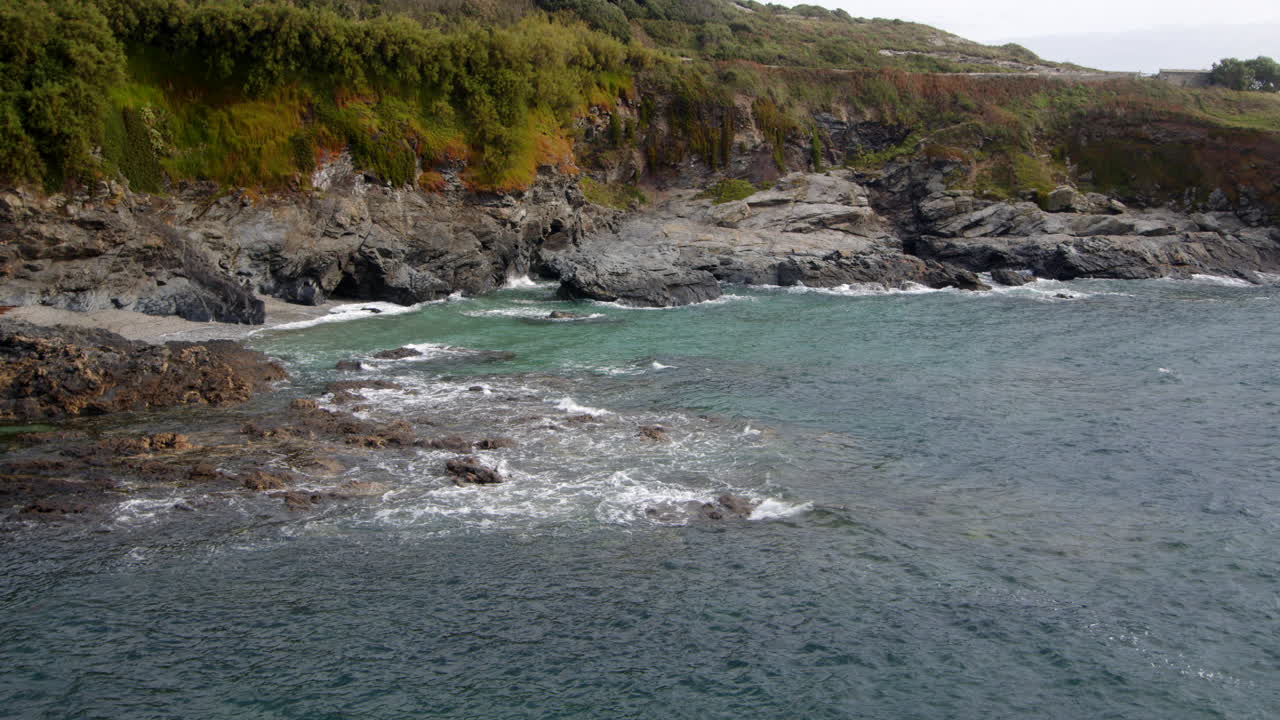 Wide shot of the sea and rocks at Bessy's Cove, The Enys, cornwall