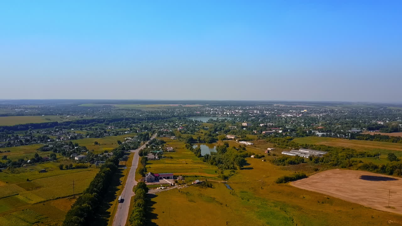 Picturesque landscape of Ukrainian rural area. Rising above the magnificent view over the fields, villages and rivers on sunny day.