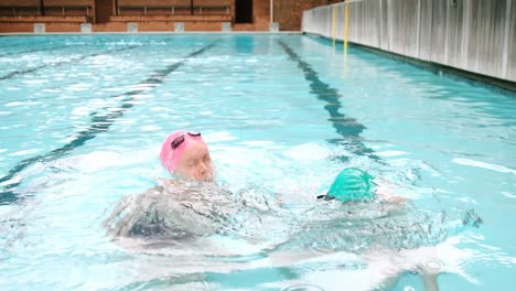 happy couple enjoying in swimming pool