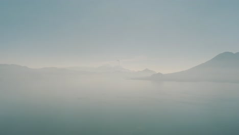 Drone-aerial-shot-of-lake-Atitlan-and-the-beautiful-volcanoes-surrounding-it-in-Guatemala