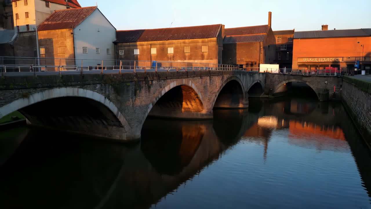Stone Bridge Over a River at Sunset