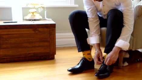 shot-of-wedding-suits,-tie,-socks,-shoes---watches-for-the-groom---groom-men