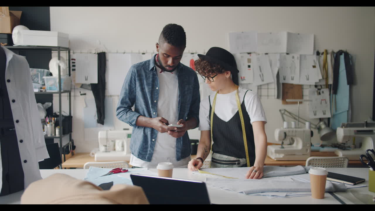 Fashion Designers Collaborating in a Studio