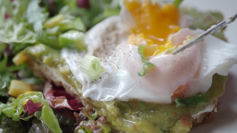 avocado toast with poached egg and salad