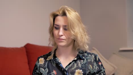 depressed woman looking at her bills