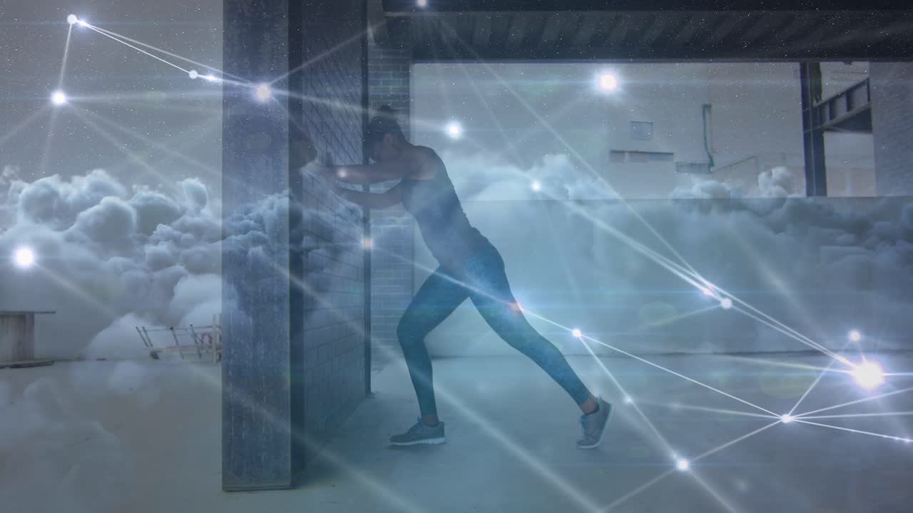Animation of clouds over african american sportswoman exercising