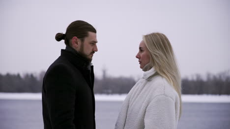 man and woman standing outdoors