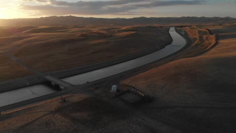 Incredible-sunset-aerial-of-California-irrigation-canal-on-the-road-to-Los-Angeles,-California