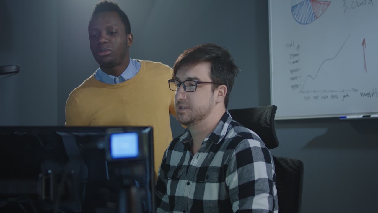 Two men collaborating on a project