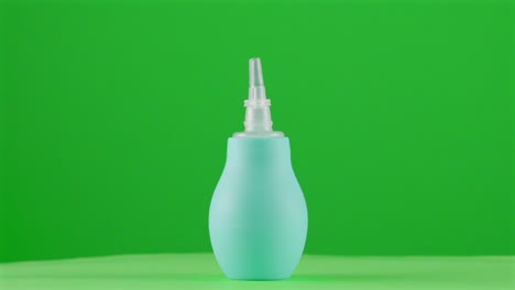 Nasal-aspirator-nose-cleaner-pump-baby-newborn-child-health-nursery-in-a-turntable-with-green-screen-for-background-removal-3d