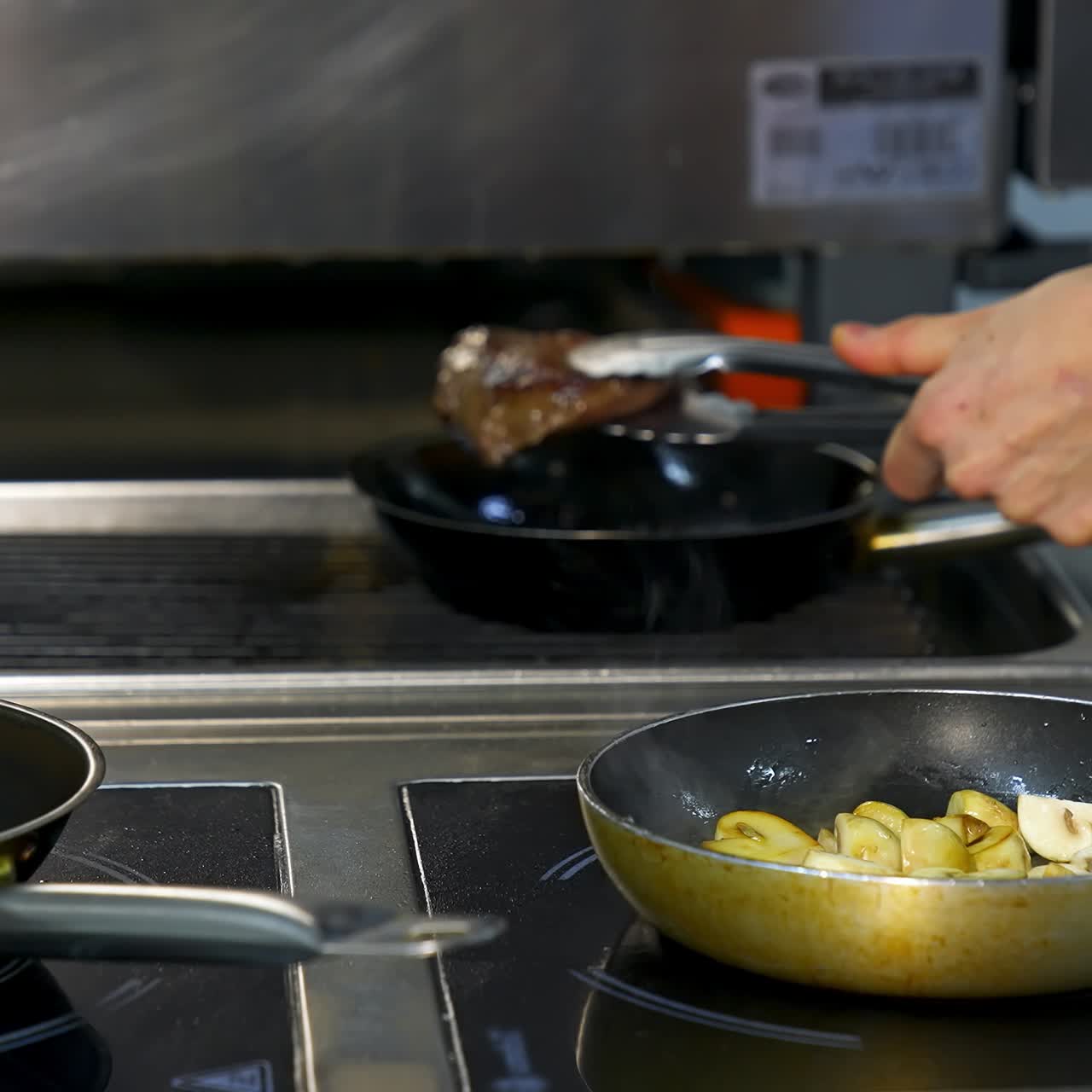 Chef preparing food with pan