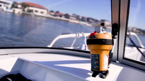 signal device on boat with coastal background