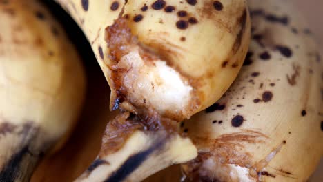 rotten brown bio fruit banana in close up which is a bad waste of food