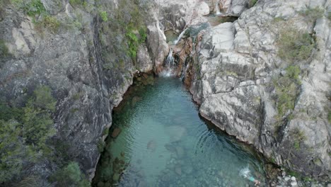 cascata da portela do homen waterfall, crystal clear pool water, gerês national park, portugal