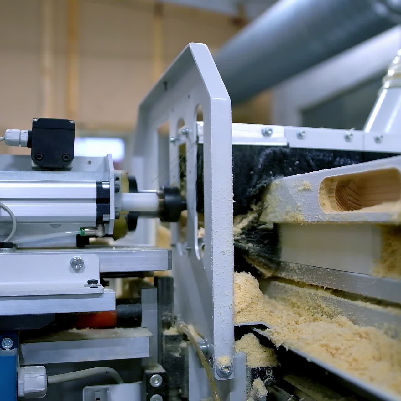 Production of doors. Making wooden doors on the automated machine tool. Modern equipment in workshop for the production of doors. Close-up.