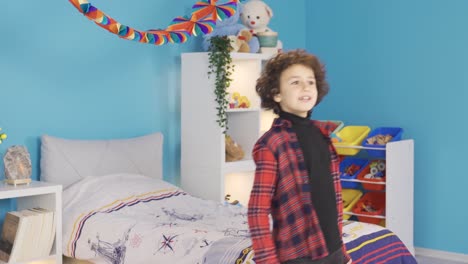 happy kid dancing in modern kids room.