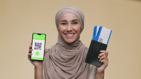 woman showing her covid-19 health pass and travel documents