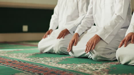muslim men praying in mosque
