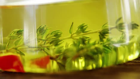 red pepper pieces and rosemary in olive oil