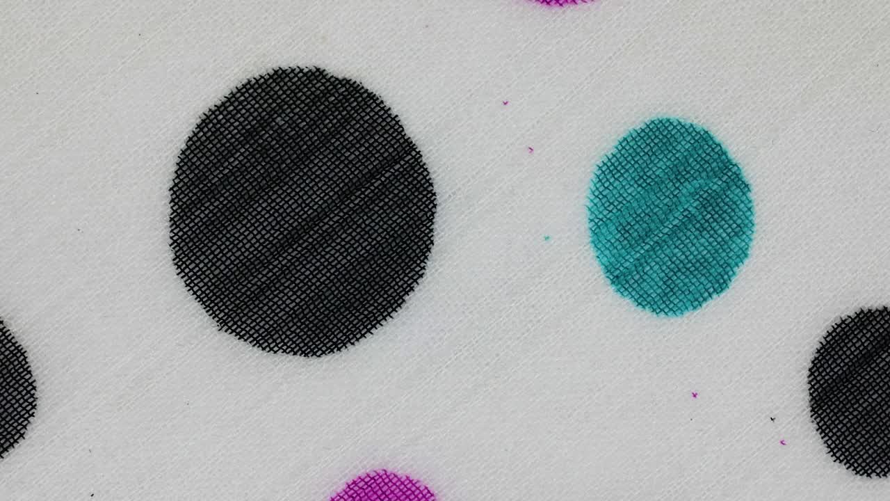 White Fabric With Colorful Polka Dots Design