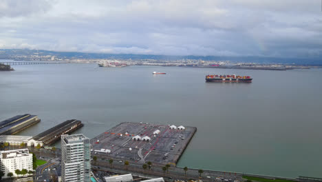 aerial view of a cargo ship carrying containers at harbour bay san francisco, ca, usa