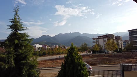 View-of-cloud-movement-in-timelapse-over-mountain-in-Denizli,-Turkey-at-daytime-from-the-beautiful-town-at-the-foothills-of-the-mountain-range