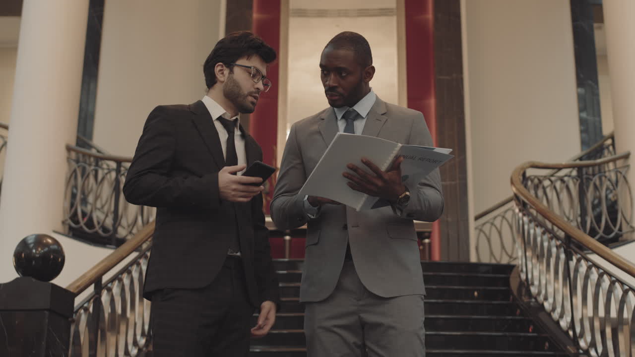 Coworkers Solving Business Problems in Hall