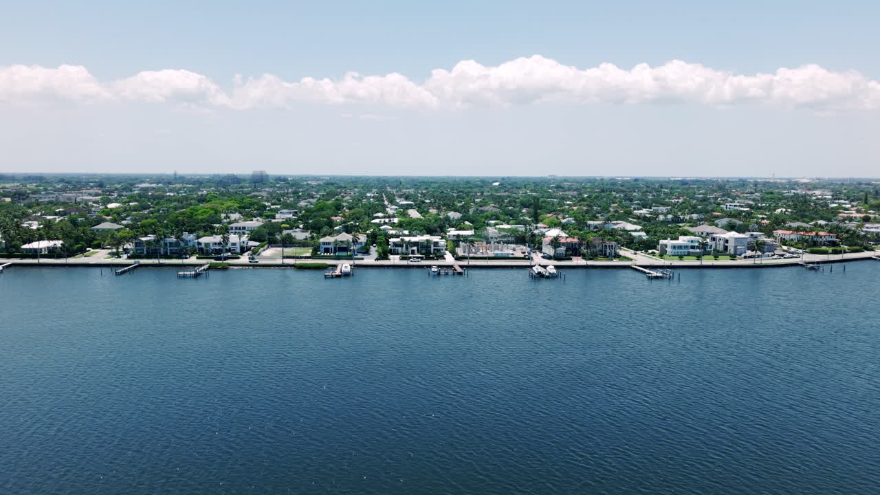 Sky high over calm bay and urban edge near South Flagler Beach, West Palm Beach
