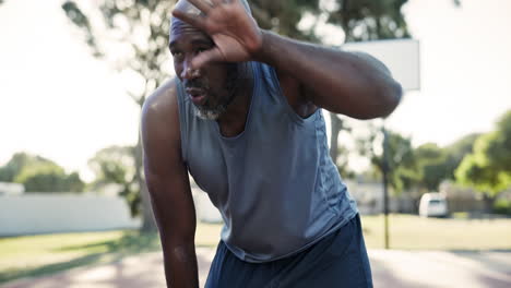 man resting after basketball