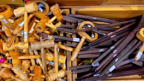 piles of wooden handmade toys on display in shop