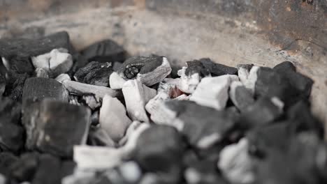 white-glowing-charcoal-in-grill-bowl-close-up