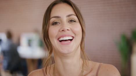 close-up-portrait-of-beautiful-young-woman-laughing-happy-enjoying-lifestyle-stylish-attractive-female-looking-stylish-in-modern-workspace-background