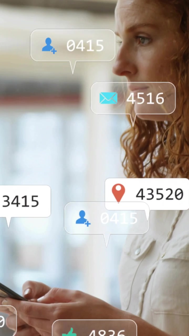 Vertical video: Woman tapping phone, checking social metrics with icon bubbles floating around