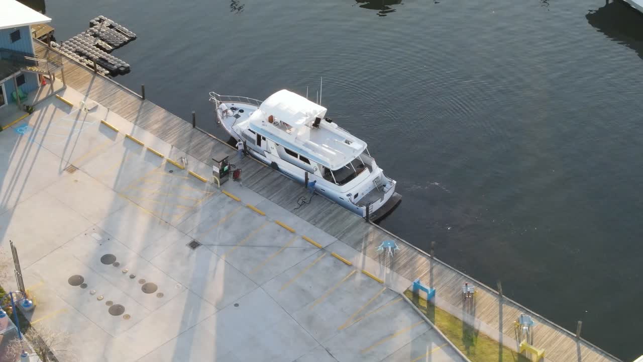 Luxury Yacht Dock Near The Parking Lot At Lakeshore Drive In West End Point, New Orleans, USA. aerial