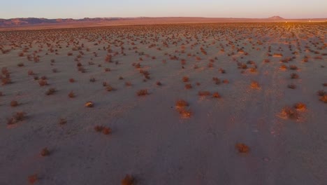 A-beautiful-fast-moving-low-aerial-over-the-Mojave-desert-at-sunrise-or-sunset-5