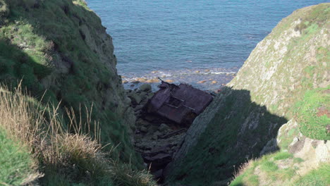 Remains-of-the-MV-RMS-Mulheim-on-the-rocks-of-Land's-End,-UK--wide