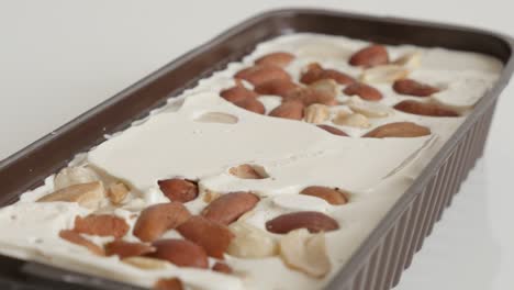 panning over nougat halva with almonds 4k footage